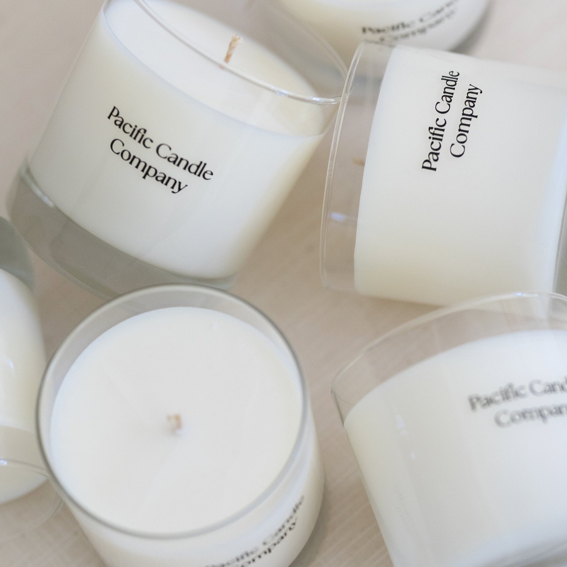 A set of hand-poured soy candles featuring the full Collection, crafted with elevated fragrances to create a warm and inviting atmosphere. Includes toxin-free candles in elegant glass jars.