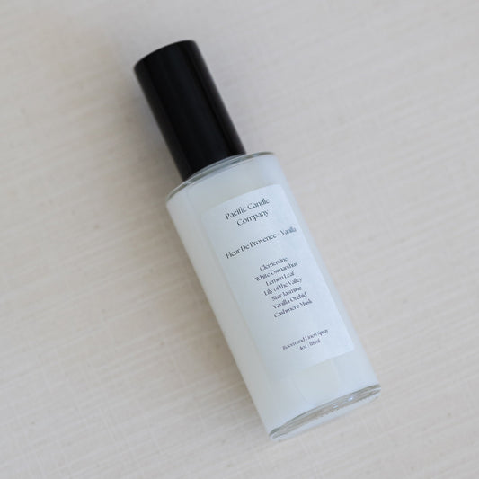 An eco-friendly room spray in a sleek amber glass bottle, made with clean, phthalate-free ingredients to refresh any space with a luxurious scent. Perfect for quickly creating a calming or uplifting atmosphere. Scent: Fleur De Provence + Vanilla.