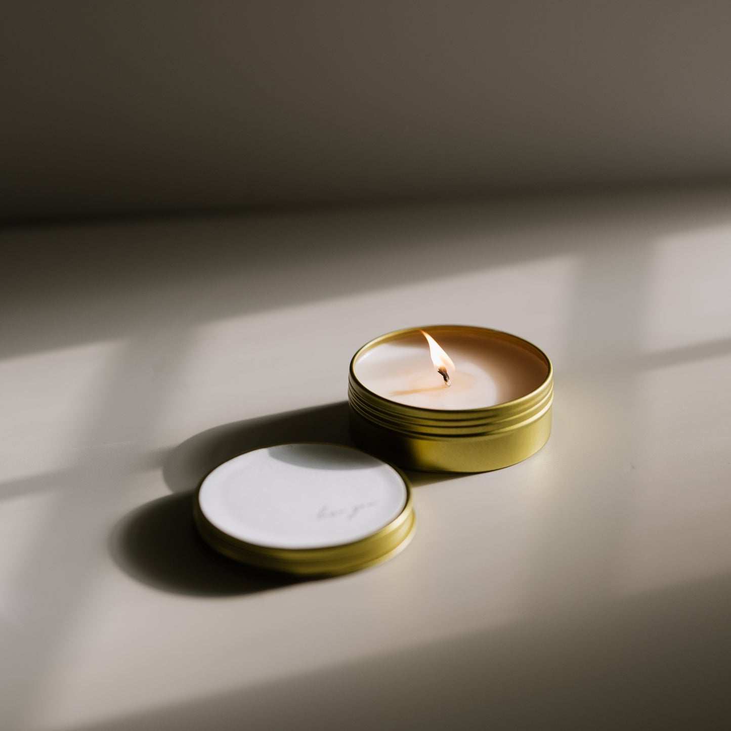 A travel-size soy candle in a stylish and reusable tin, hand-poured with clean, eco-friendly wax for on-the-go luxury. Ideal for gifting or bringing a cozy atmosphere to any space.