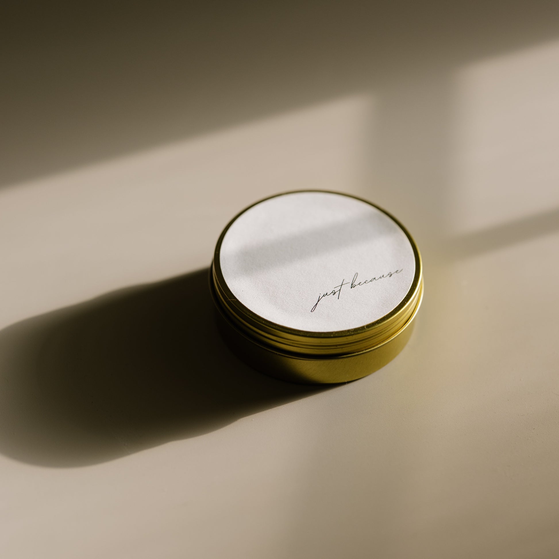 Just Because. A travel-size soy candle in a stylish and reusable tin, hand-poured with clean, eco-friendly wax for on-the-go luxury. Ideal for gifting or bringing a cozy atmosphere to any space.