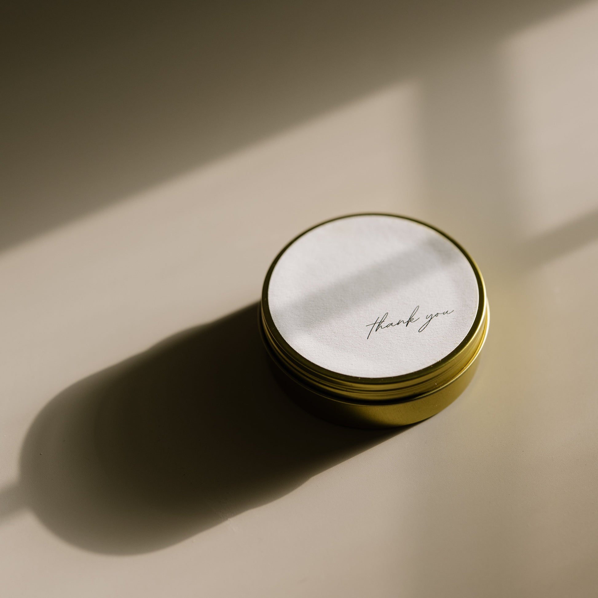 Thank You. A travel-size soy candle in a stylish and reusable tin, hand-poured with clean, eco-friendly wax for on-the-go luxury. Ideal for gifting or bringing a cozy atmosphere to any space.