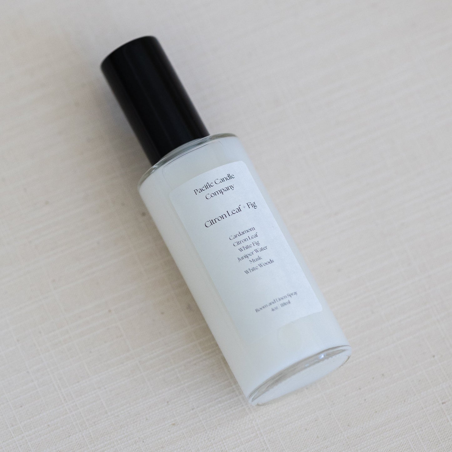 An eco-friendly room spray in a sleek amber glass bottle, made with clean, phthalate-free ingredients to refresh any space with a luxurious scent. Perfect for quickly creating a calming or uplifting atmosphere. Scent: Citron Leaf + Fig