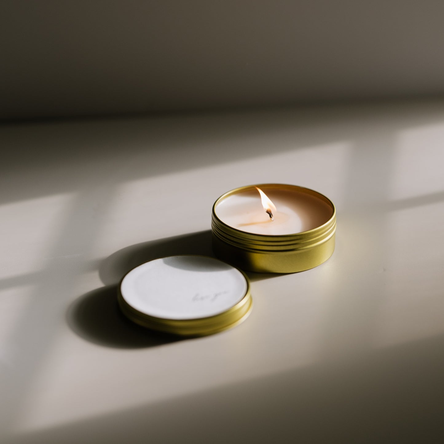 A travel-size soy candle in a stylish and reusable tin, hand-poured with clean, eco-friendly wax for on-the-go luxury. Ideal for gifting or bringing a cozy atmosphere to any space.