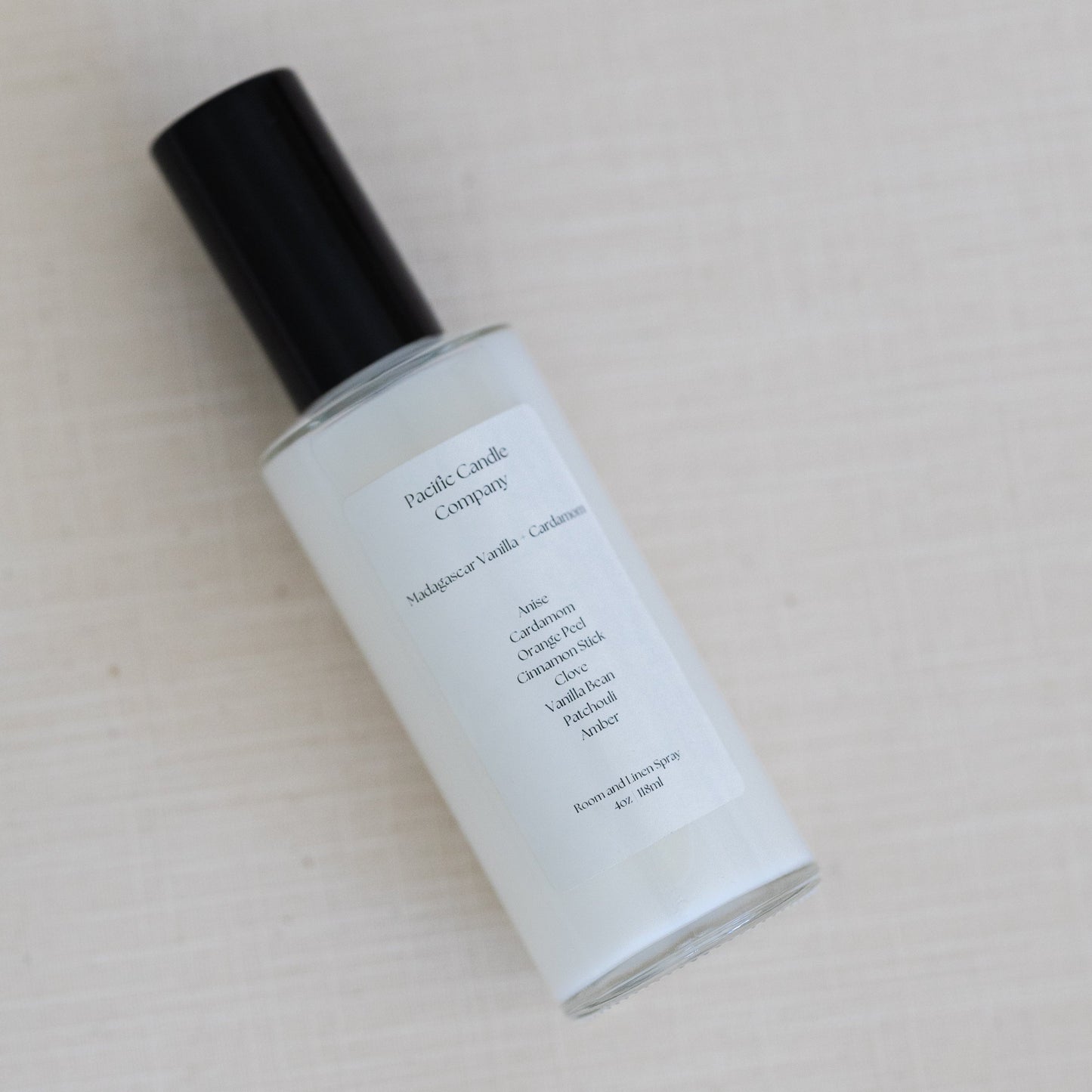 An eco-friendly room spray in a sleek amber glass bottle, made with clean, phthalate-free ingredients to refresh any space with a luxurious scent. Perfect for quickly creating a calming or uplifting atmosphere. Scent: Madagascar Vanilla + Cardamom