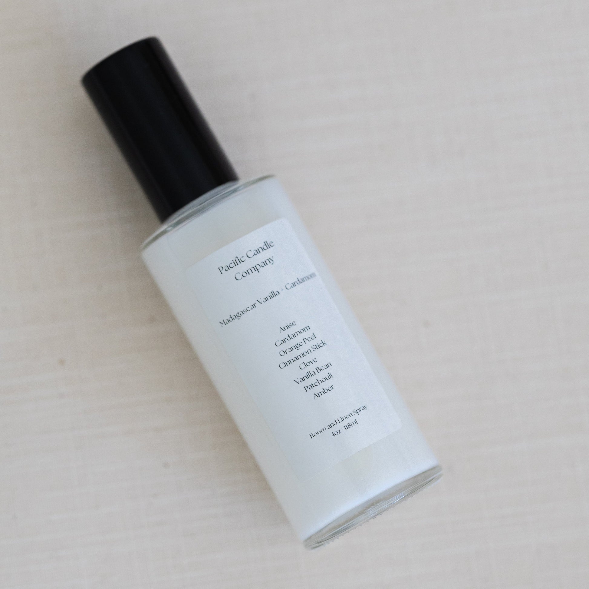 An eco-friendly room spray in a sleek amber glass bottle, made with clean, phthalate-free ingredients to refresh any space with a luxurious scent. Perfect for quickly creating a calming or uplifting atmosphere. Scent: Madagascar Vanilla + Cardamom