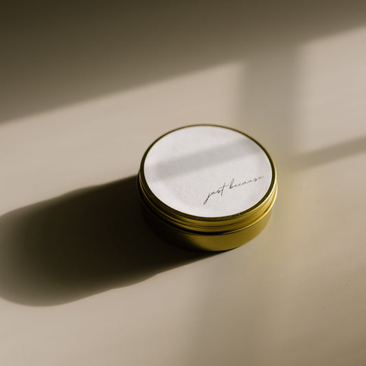 Just Because. A travel-size soy candle in a stylish and reusable tin, hand-poured with clean, eco-friendly wax for on-the-go luxury. Ideal for gifting or bringing a cozy atmosphere to any space.